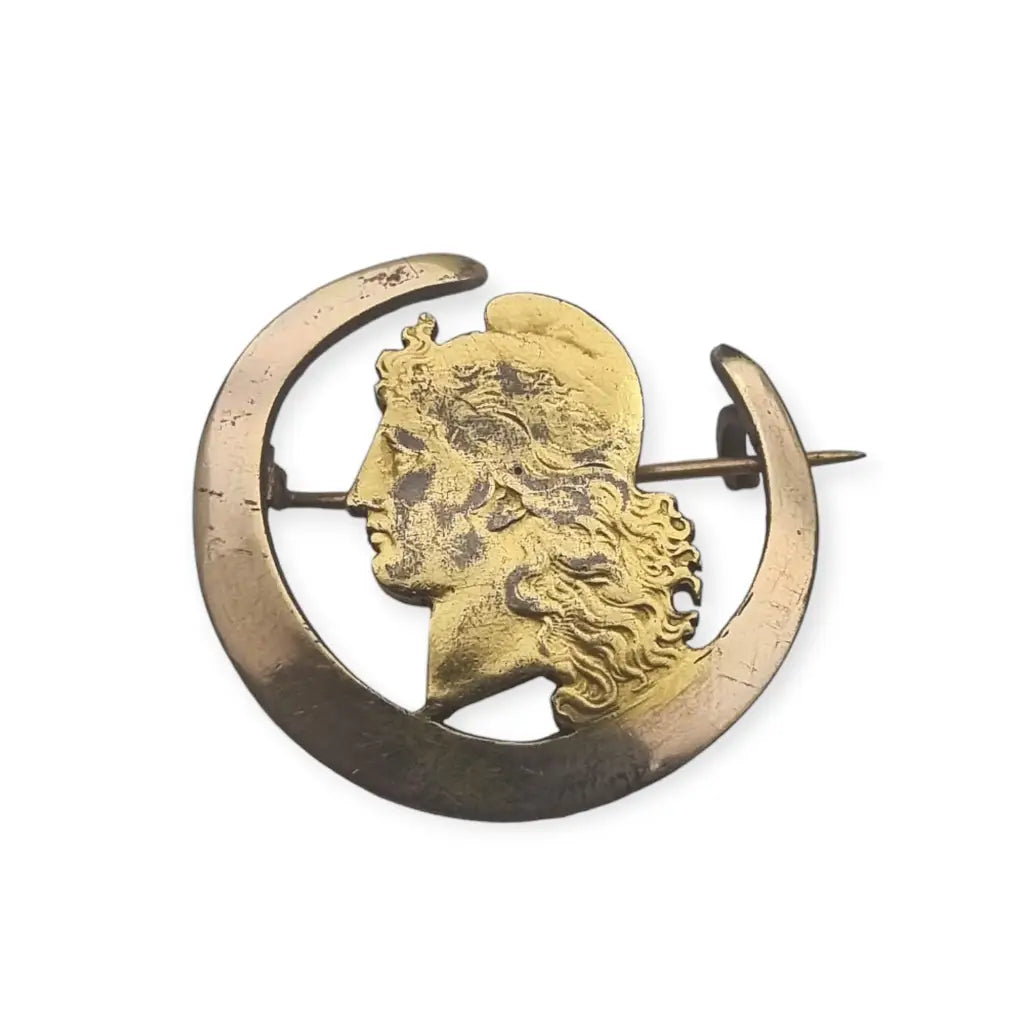 Antique Argentine coin brooch of Marianne and a half moon, symbol of freedom.