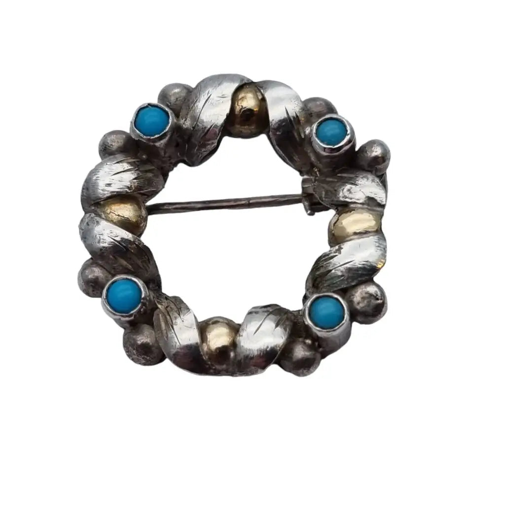 Antique round brooch from the 50s in silver and gold with turquoise blue balls.