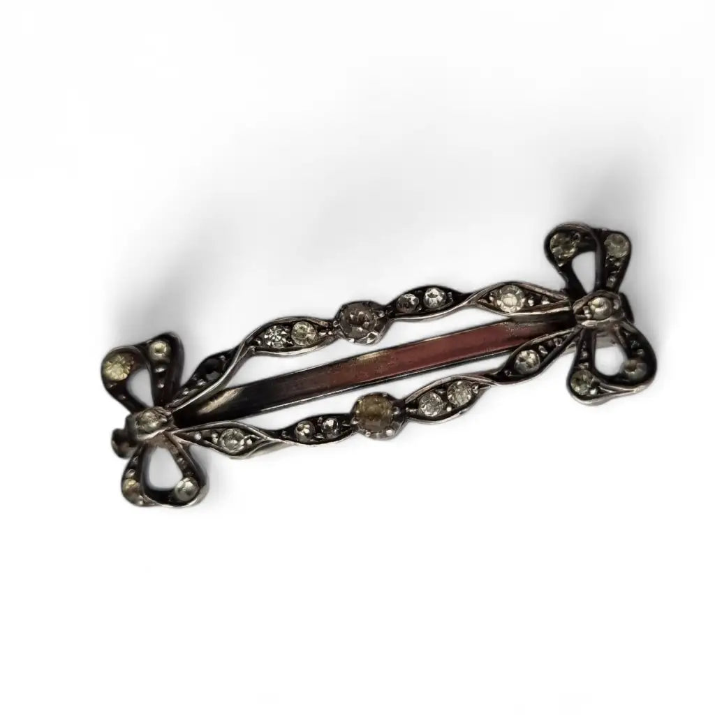 Art Nouveau silver brooch with bows and white rhinestones for women.