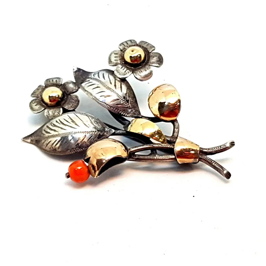 Antique coral brooch. Silver, gold and coral brooch. Bouquet of flowers.