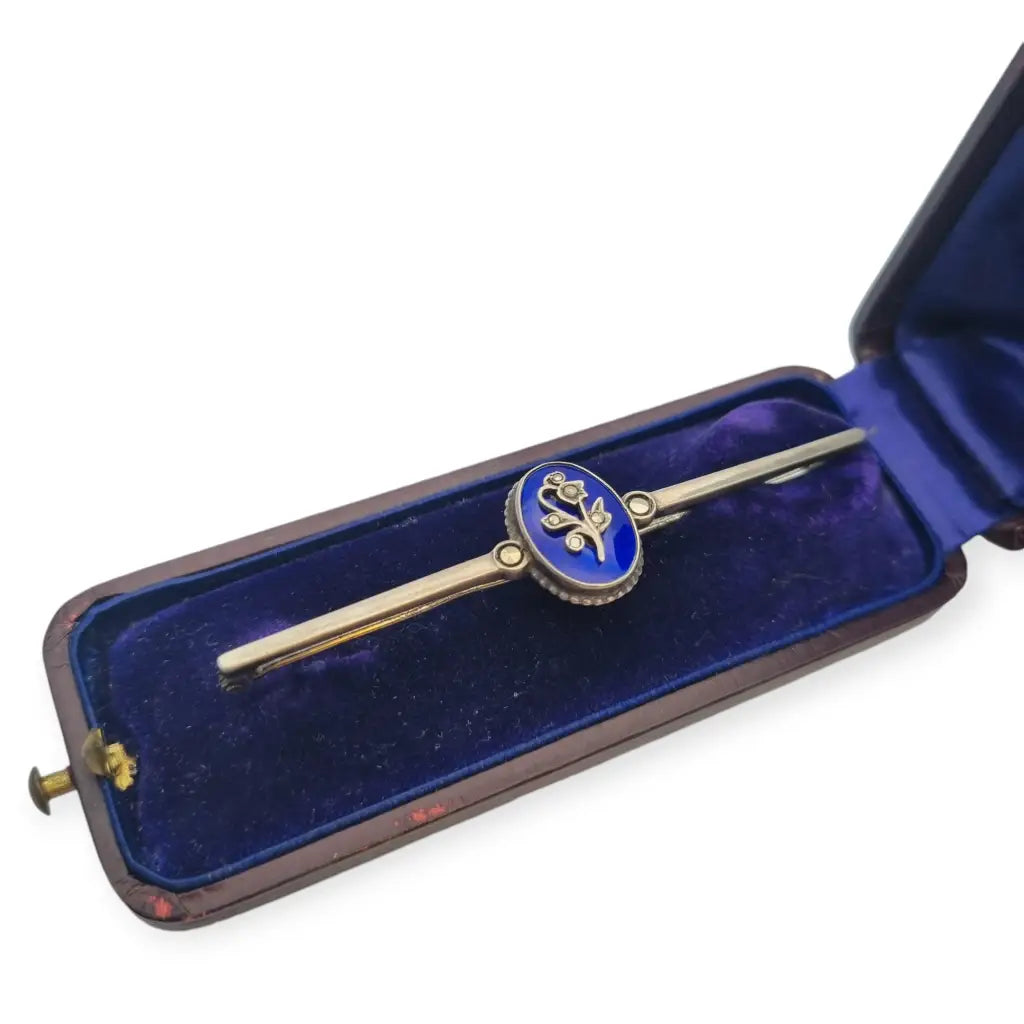 Victorian style brooch in silver with blue enamel, includes original box.