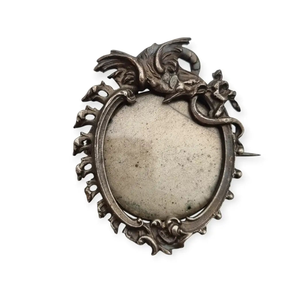 Art Nouveau metal photo brooch, decorative frame locket and dragon.