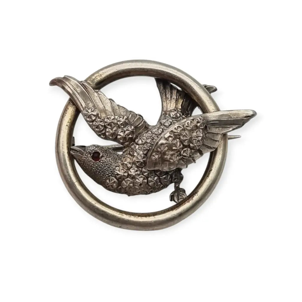 Victorian silver bird and circle brooch, symbol of love, 1900.